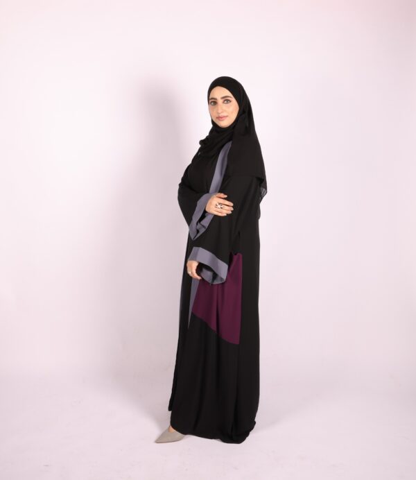 A two-piece abaya in black with subtle accents in gray and berry - Image 4